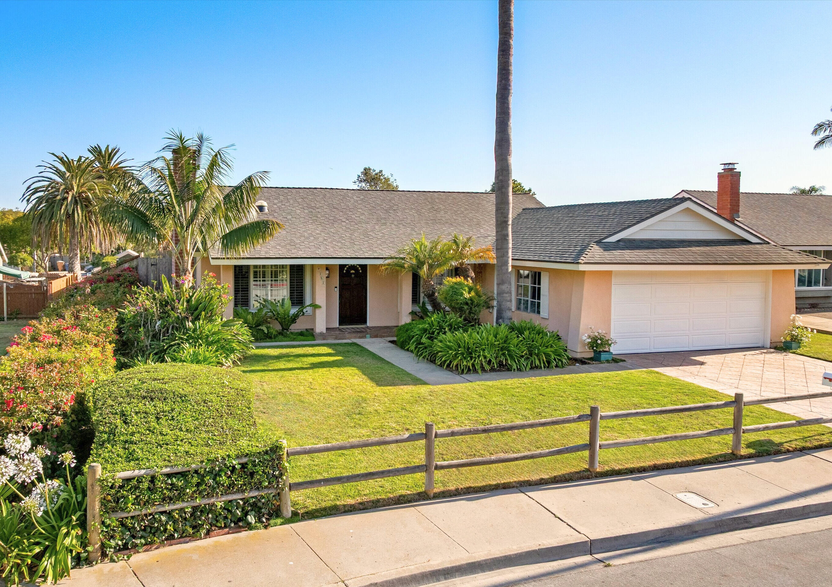 4565 Chapparral Drive Carpinteria, CA 93013 - Photo 2 of 23 a front view of a house with garden