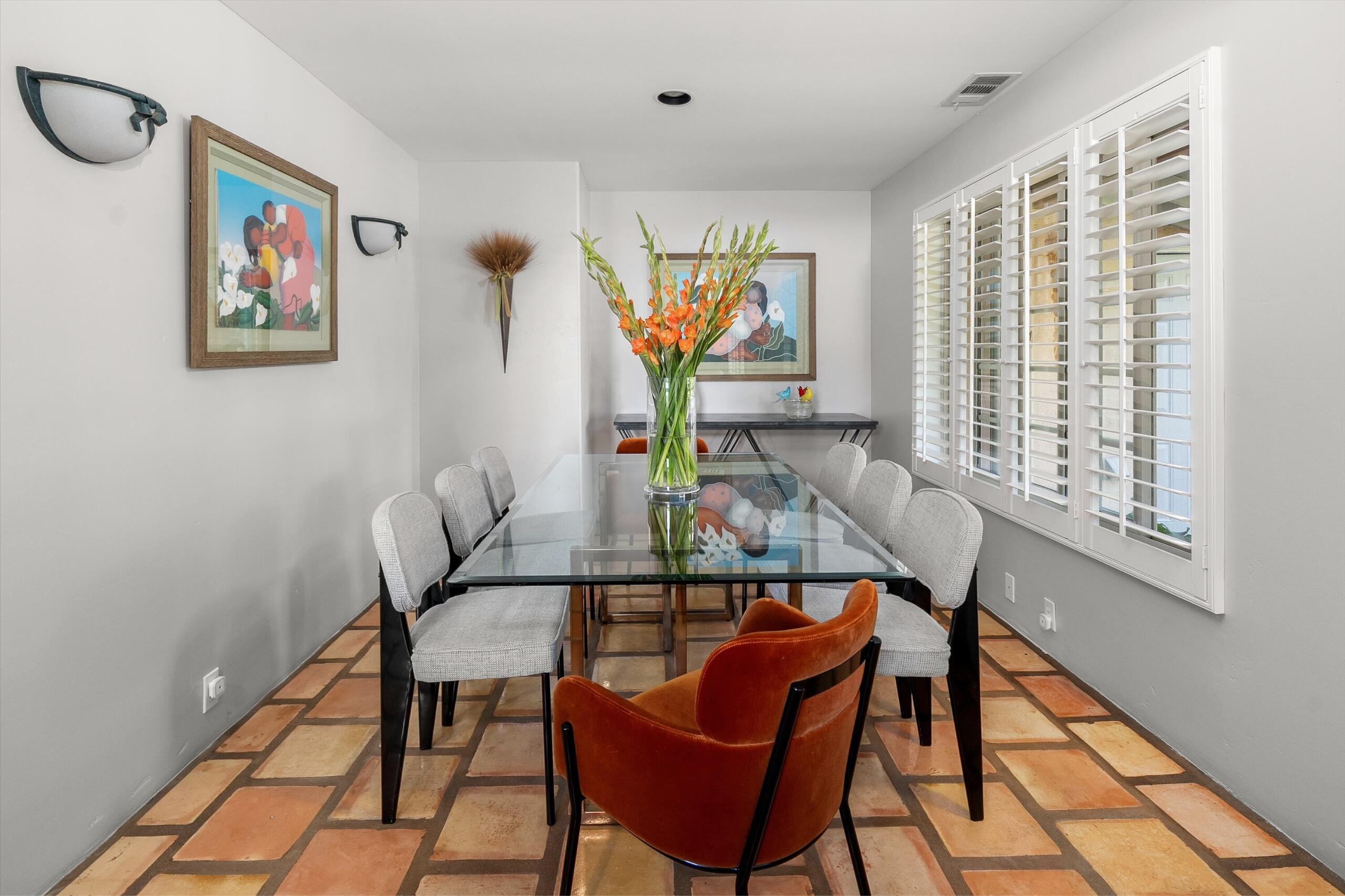4565 Chapparral Drive Carpinteria, CA 93013 - Photo 7 of 23 a view of a dining room with furniture a chandelier and wooden floor