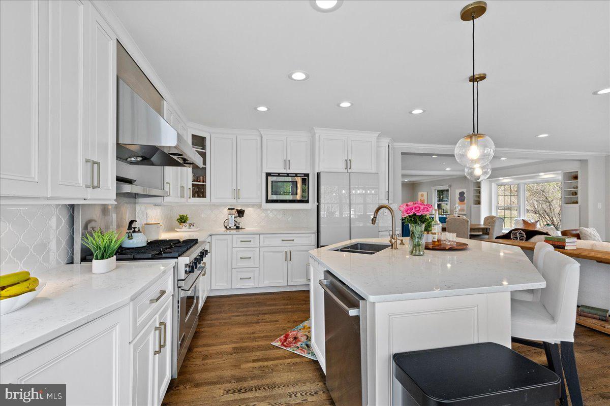 67 Randall Road Princeton, NJ 08540 - Photo 16 of 47 a kitchen with a sink stove and cabinets