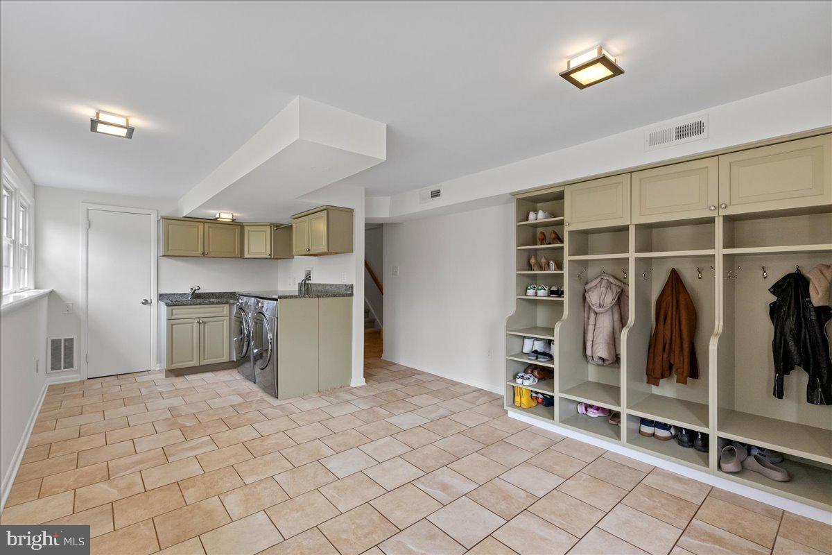 67 Randall Road Princeton, NJ 08540 - Photo 20 of 47 a kitchen with stainless steel appliances kitchen island granite countertop a refrigerator and a sink