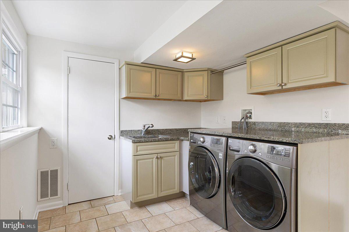67 Randall Road Princeton, NJ 08540 - Photo 21 of 47 a utility room with sink dryer and washer
