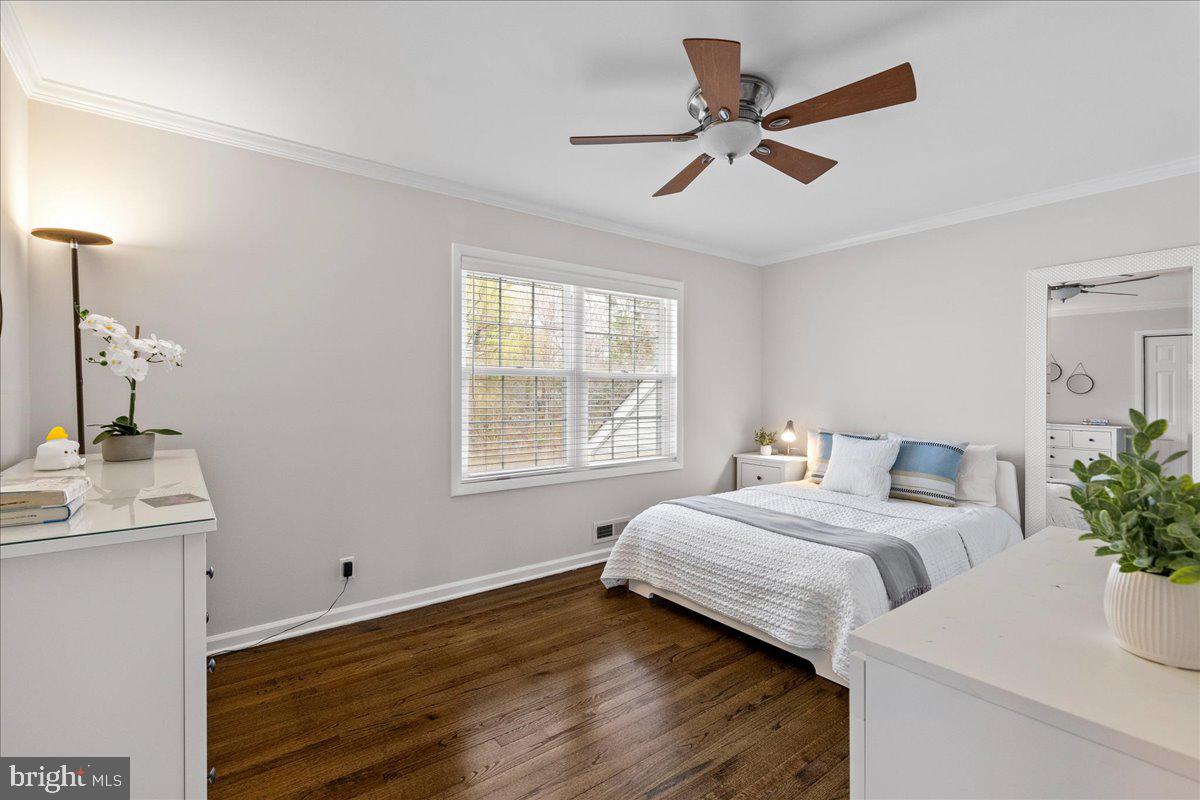 67 Randall Road Princeton, NJ 08540 - Photo 23 of 47 a bedroom with a bed and a potted plant