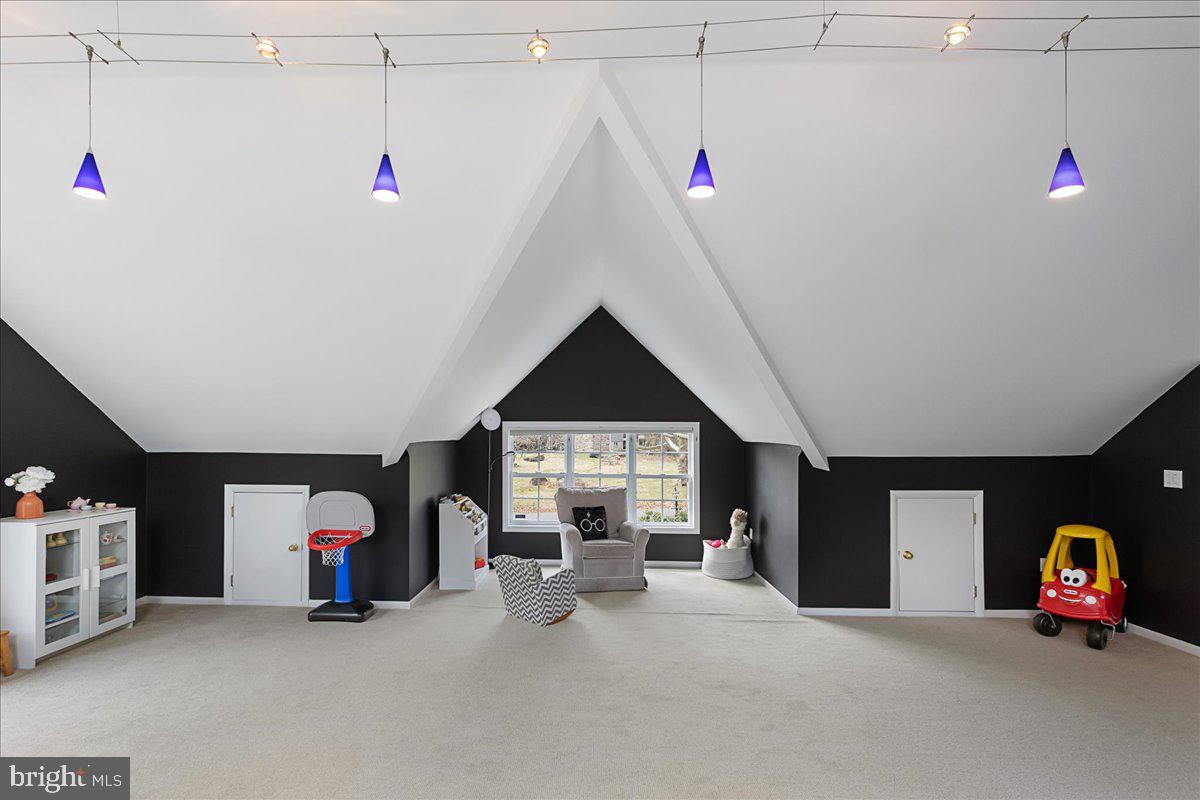 67 Randall Road Princeton, NJ 08540 - Photo 27 of 47 a living room with furniture and a chandelier