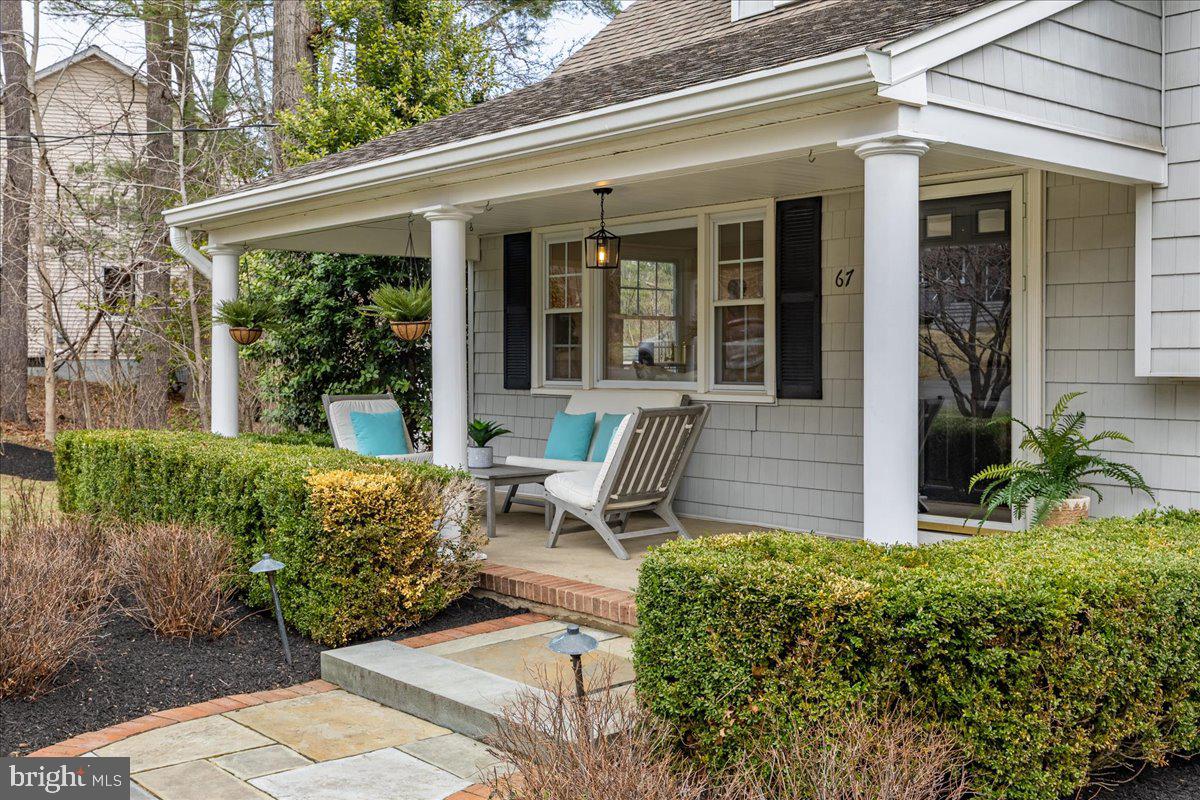 67 Randall Road Princeton, NJ 08540 - Photo 3 of 47 front view of a house with a chairs and table in a patio