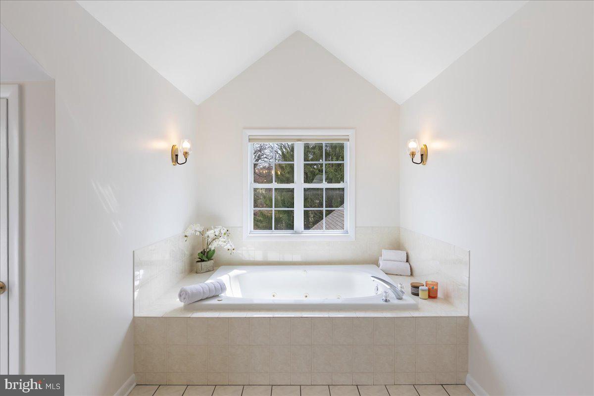67 Randall Road Princeton, NJ 08540 - Photo 34 of 47 a white bath tub sitting in a bathroom next to a window