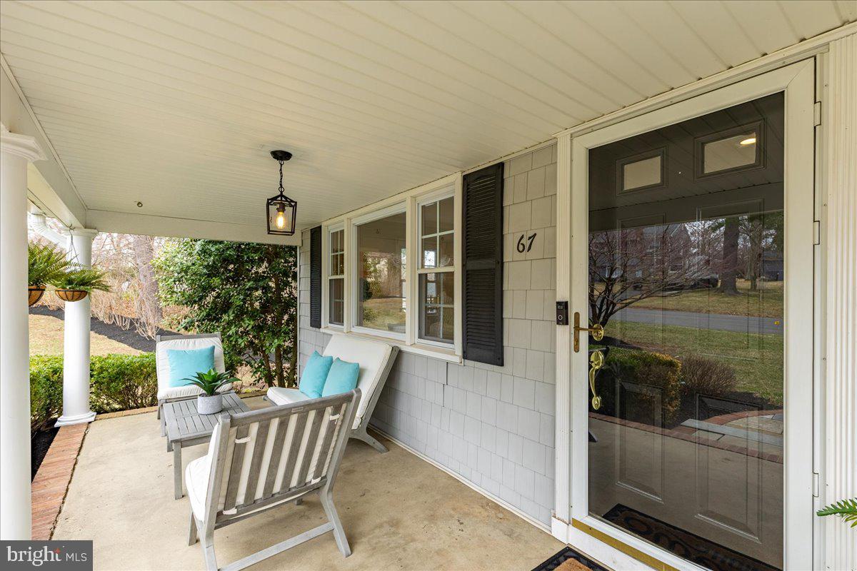 67 Randall Road Princeton, NJ 08540 - Photo 4 of 47 a view of a porch with furniture and floor to ceiling window