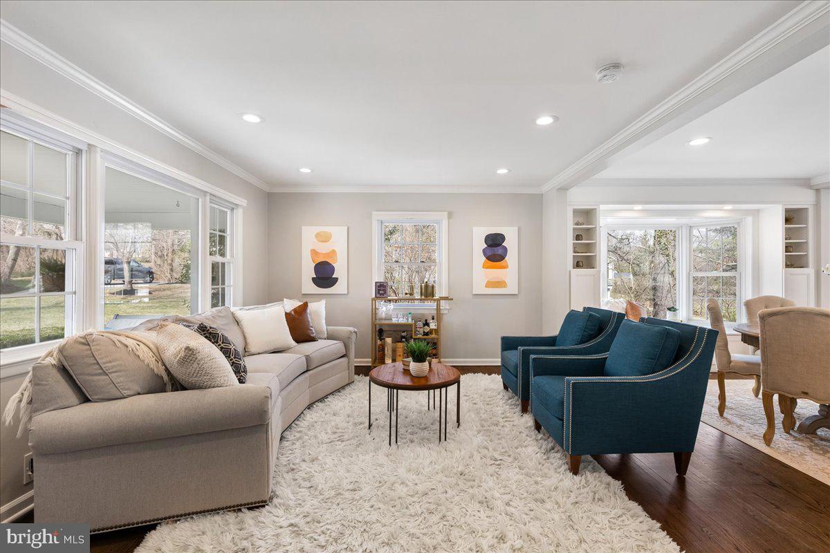 67 Randall Road Princeton, NJ 08540 - Photo 8 of 47 a living room with furniture potted plant and a large window