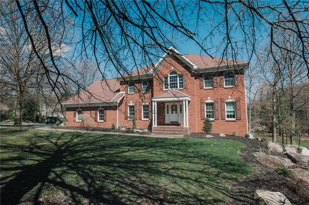 301 Forest Ridge Road Indiana, PA 15701 - Photo 1 of 41 a front view of a house with a garden