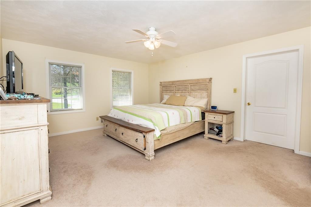 301 Forest Ridge Road Indiana, PA 15701 - Photo 32 of 41 a bedroom with a bed and a chandelier