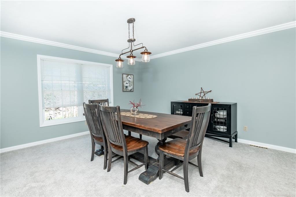 301 Forest Ridge Road Indiana, PA 15701 - Photo 7 of 41 a view of a dining room with furniture window and wooden floor