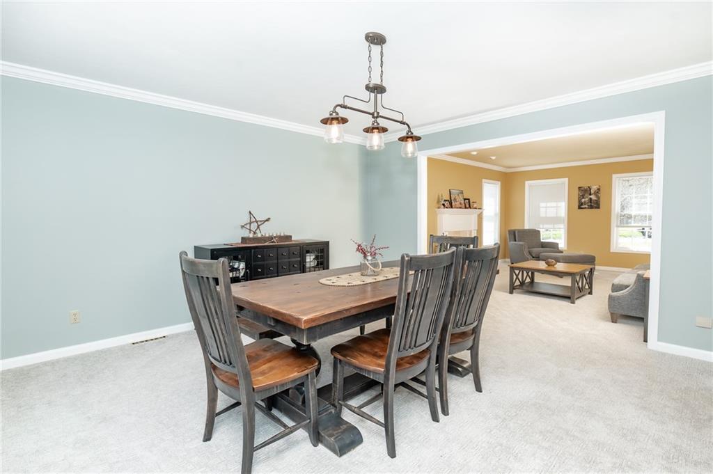 301 Forest Ridge Road Indiana, PA 15701 - Photo 8 of 41 a dining room with furniture a chandelier and a rug