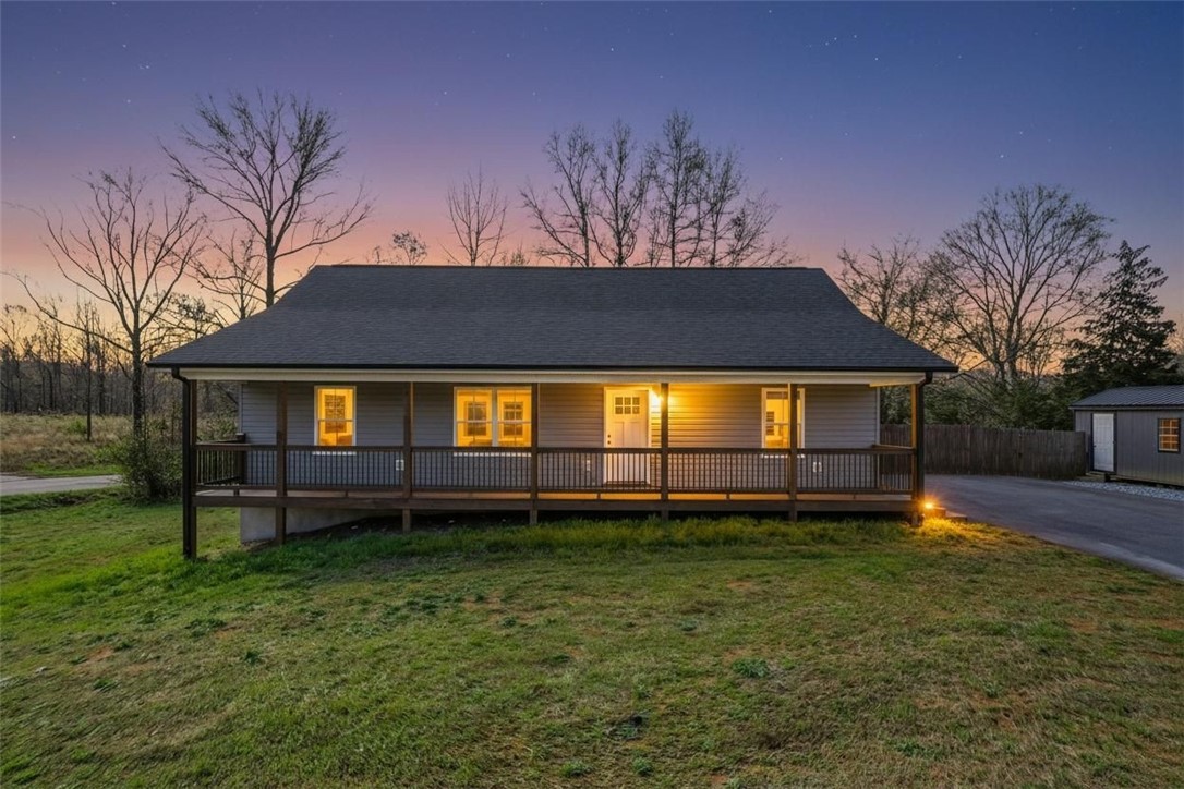 This charming home features a welcoming porch, perfect for enjoying peaceful evenings.