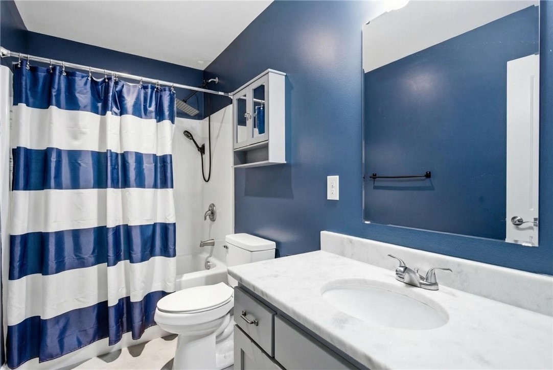 745 Dave Nix Road Seneca, SC 29678 - Photo 16 of 32 This bathroom features a sleek vanity and a tub with a shower.