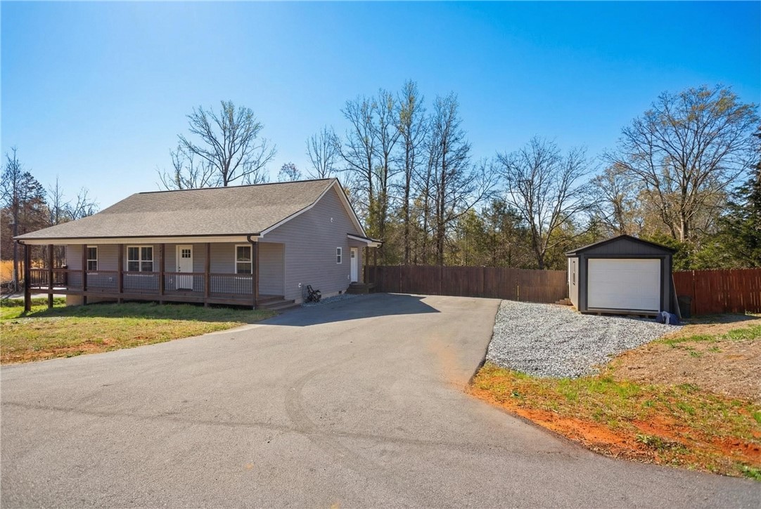 745 Dave Nix Road Seneca, SC 29678 - Photo 26 of 32 This charming home offers a spacious porch and a detached storage shed, all set on a generous lot.