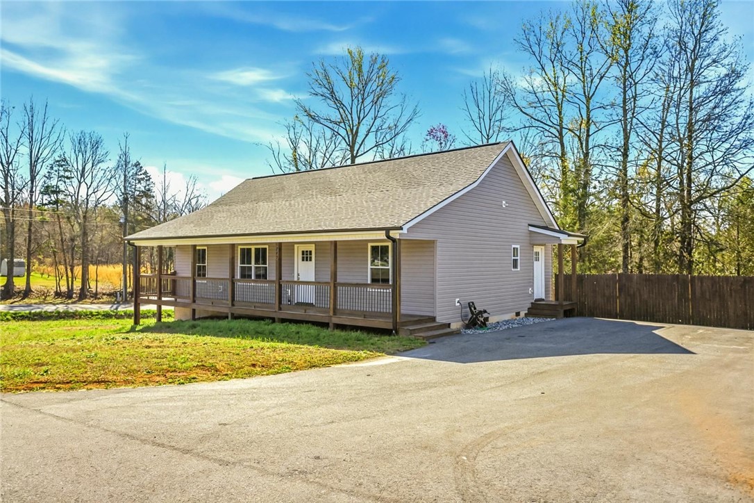 745 Dave Nix Road Seneca, SC 29678 - Photo 27 of 32 This charming home offers a welcoming front porch and a spacious driveway.