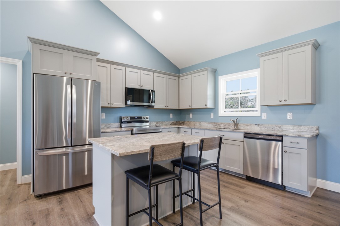 745 Dave Nix Road Seneca, SC 29678 - Photo 5 of 32 This modern kitchen features vaulted ceilings, ample cabinetry, and sleek stainless steel appliances.