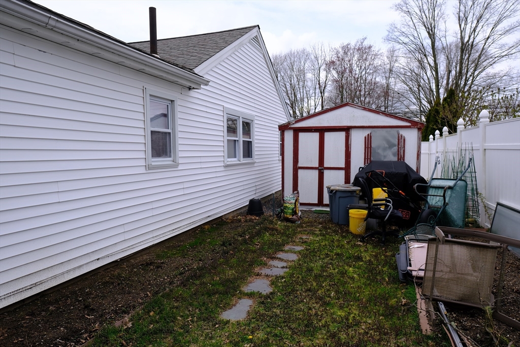 9 Stanley Street Natick, MA 01760 - Photo 11 of 42 a front view of a house with garden