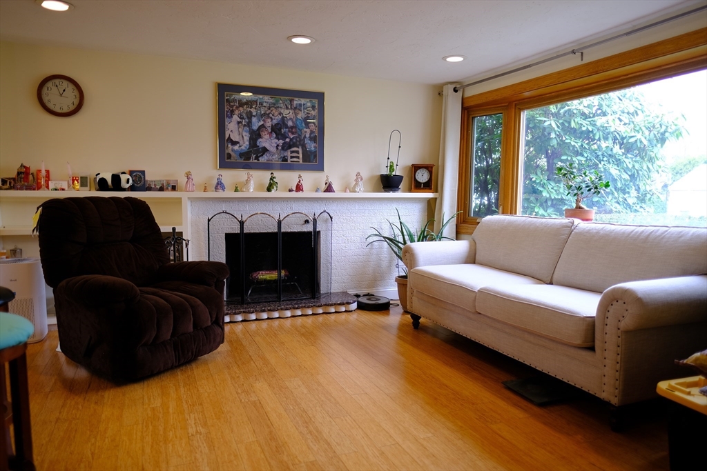 9 Stanley Street Natick, MA 01760 - Photo 21 of 42 a living room with furniture and a fireplace