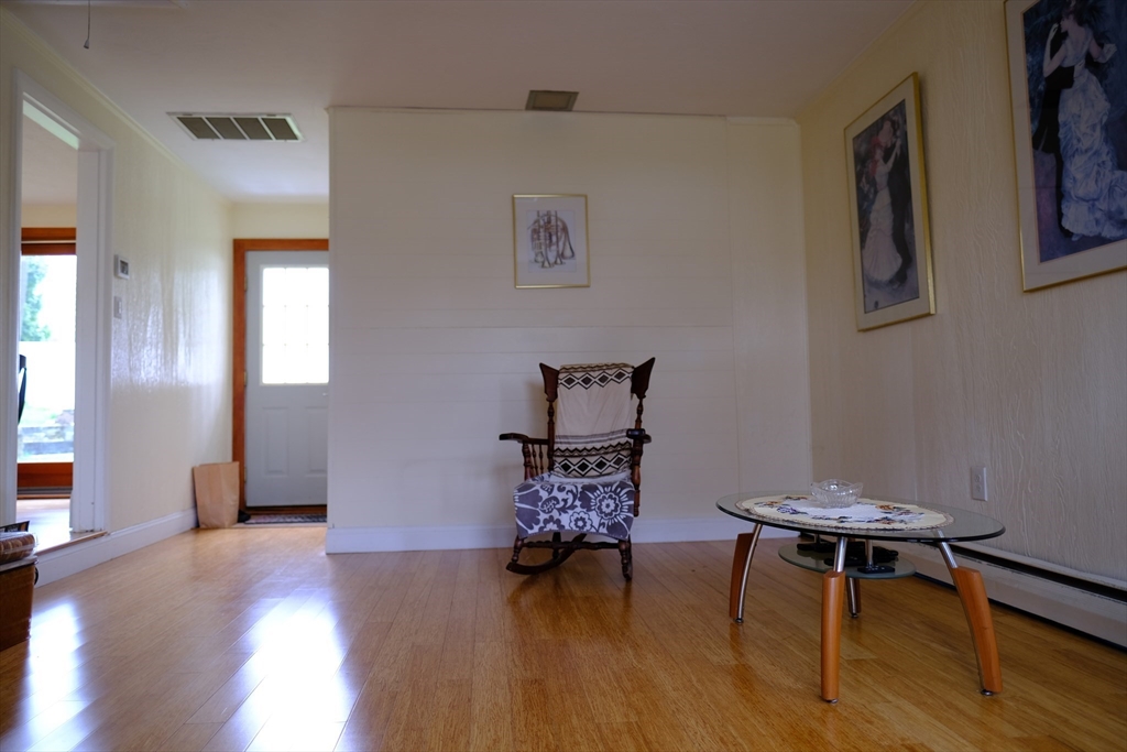 9 Stanley Street Natick, MA 01760 - Photo 24 of 42 a hallway with table and chairs