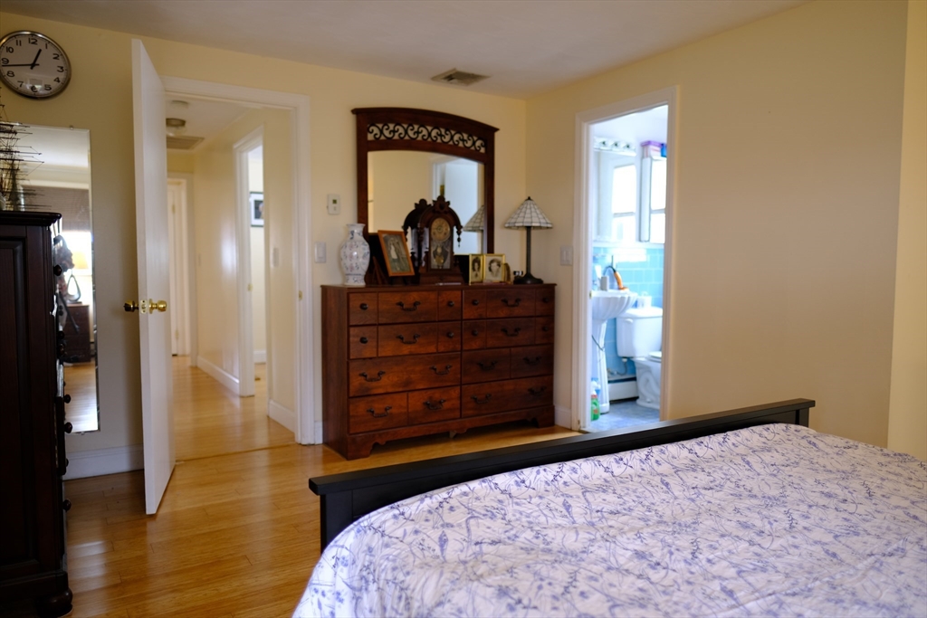 9 Stanley Street Natick, MA 01760 - Photo 32 of 42 a bedroom with a bed and a dresser