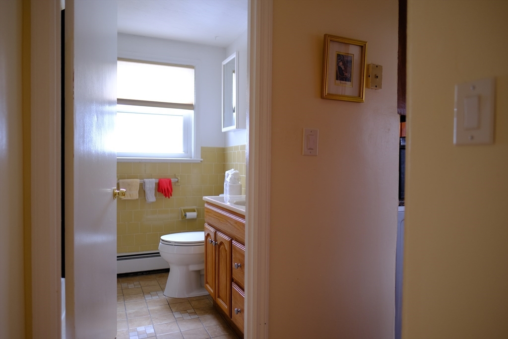 9 Stanley Street Natick, MA 01760 - Photo 34 of 42 a bathroom with a toilet and a sink
