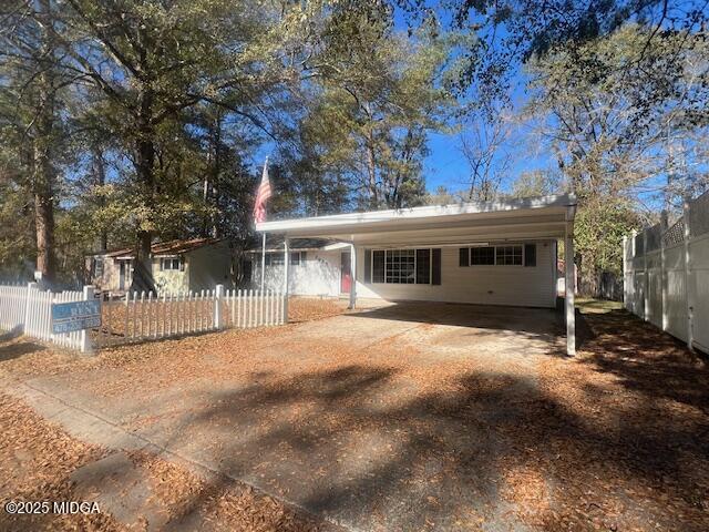 3935 Travis Boulevard Macon, GA 31206 - Photo 1 of 15 a front view of a house with a yard