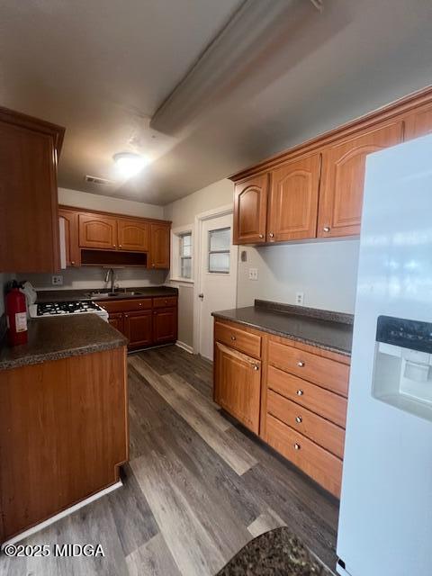 3935 Travis Boulevard Macon, GA 31206 - Photo 4 of 15 a kitchen with stainless steel appliances granite countertop a stove a sink and a refrigerator