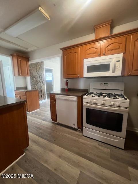 3935 Travis Boulevard Macon, GA 31206 - Photo 5 of 15 a kitchen with stainless steel appliances granite countertop a stove a sink and a microwave