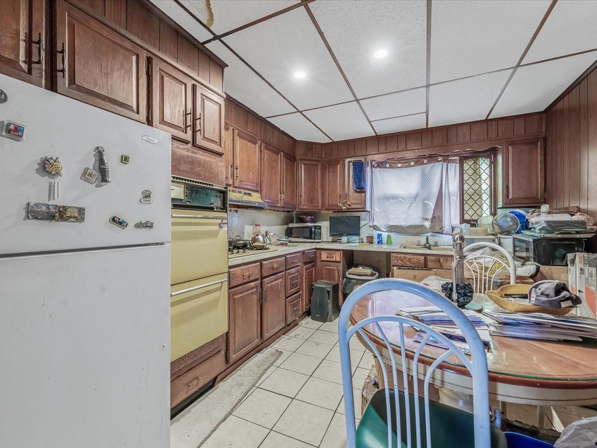 1775 Troy Avenue Brooklyn, NY 11234 - Photo 5 of 17 a kitchen with granite countertop a sink stove and refrigerator