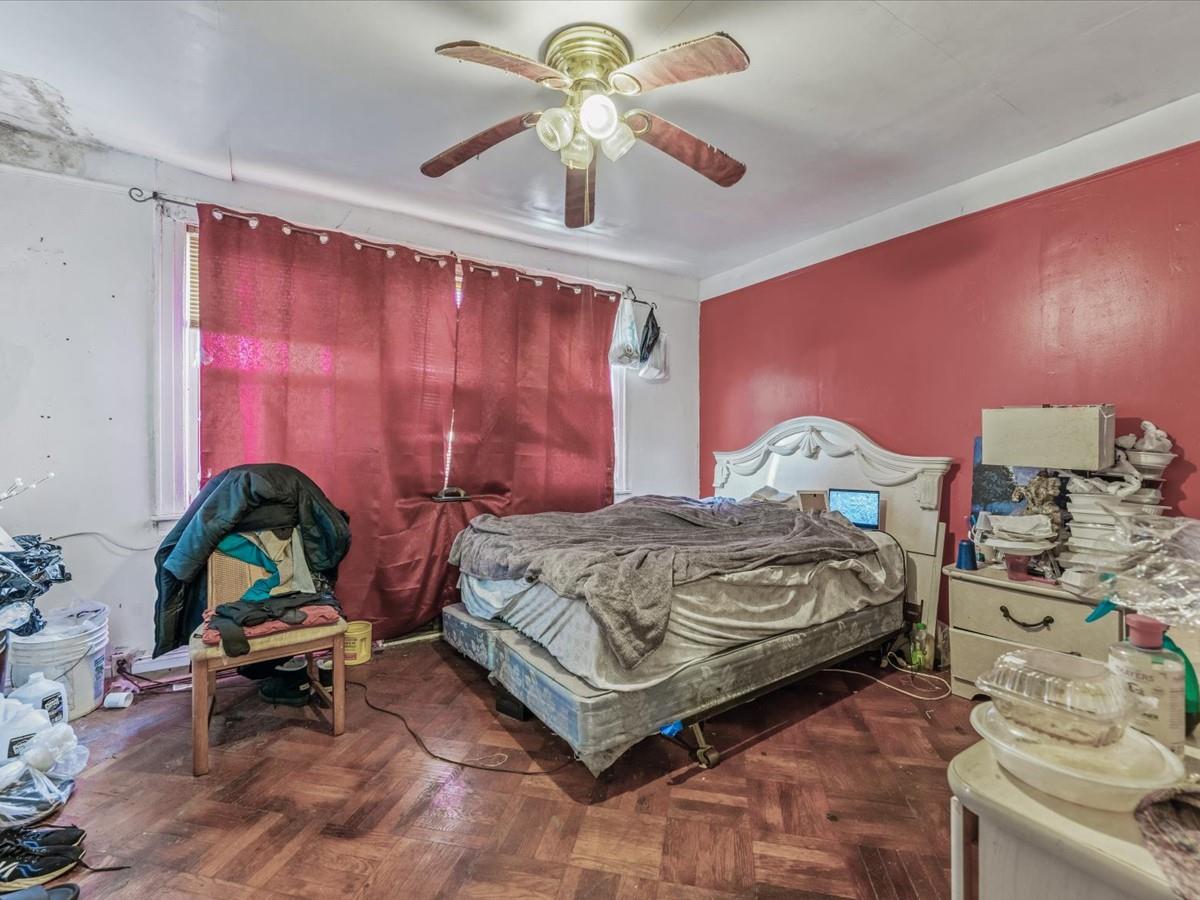 1775 Troy Avenue Brooklyn, NY 11234 - Photo 6 of 17 a bedroom with a bed and a chandelier