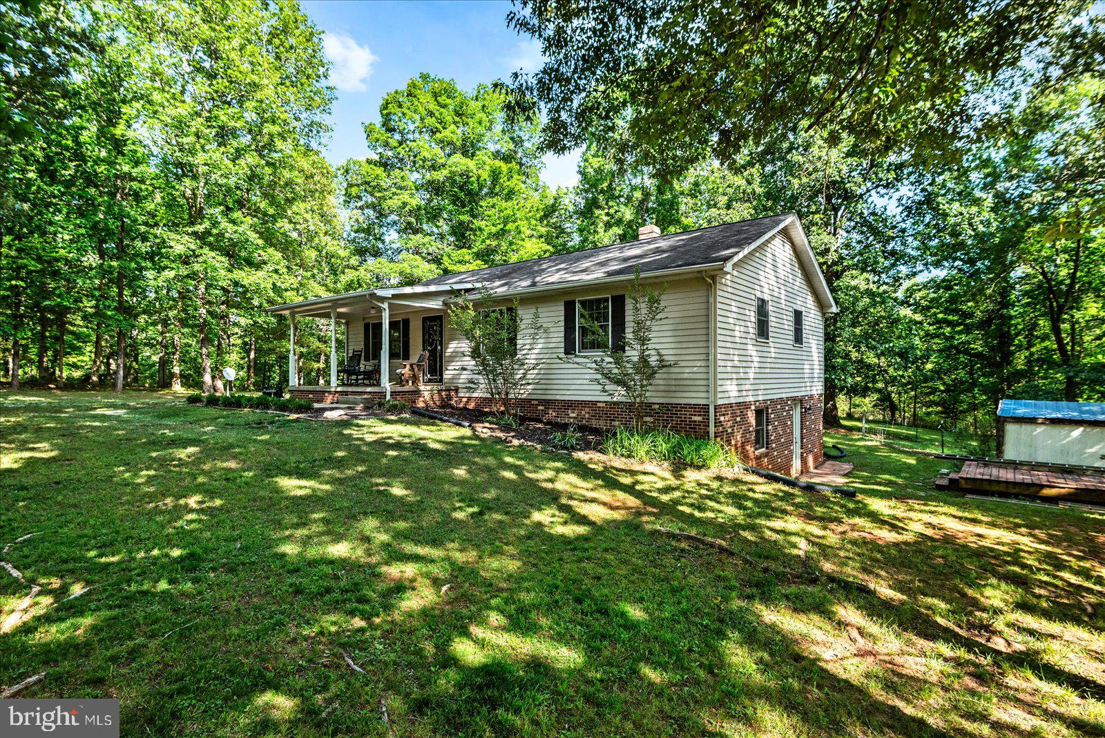 804 Buggy Lane Rochelle, VA 22738 - Photo 5 of 50 a front view of a house with a yard