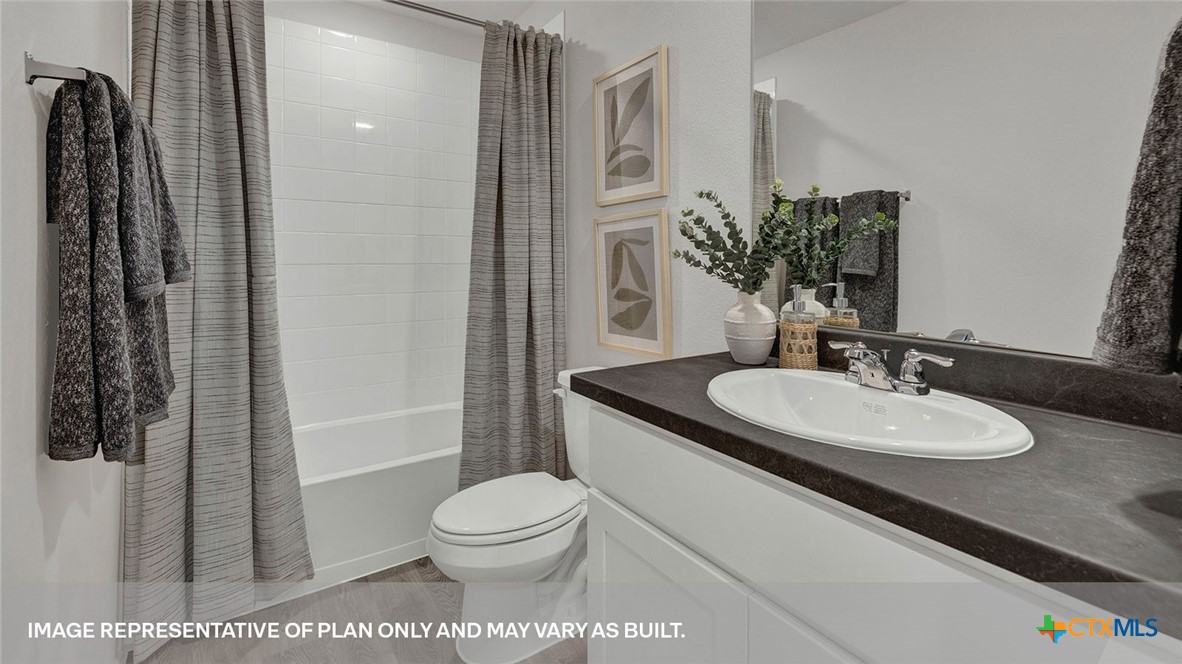 125 Kendall Lane Lockhart, TX 78644 - Photo 24 of 30 a bathroom with a sink toilet and shower