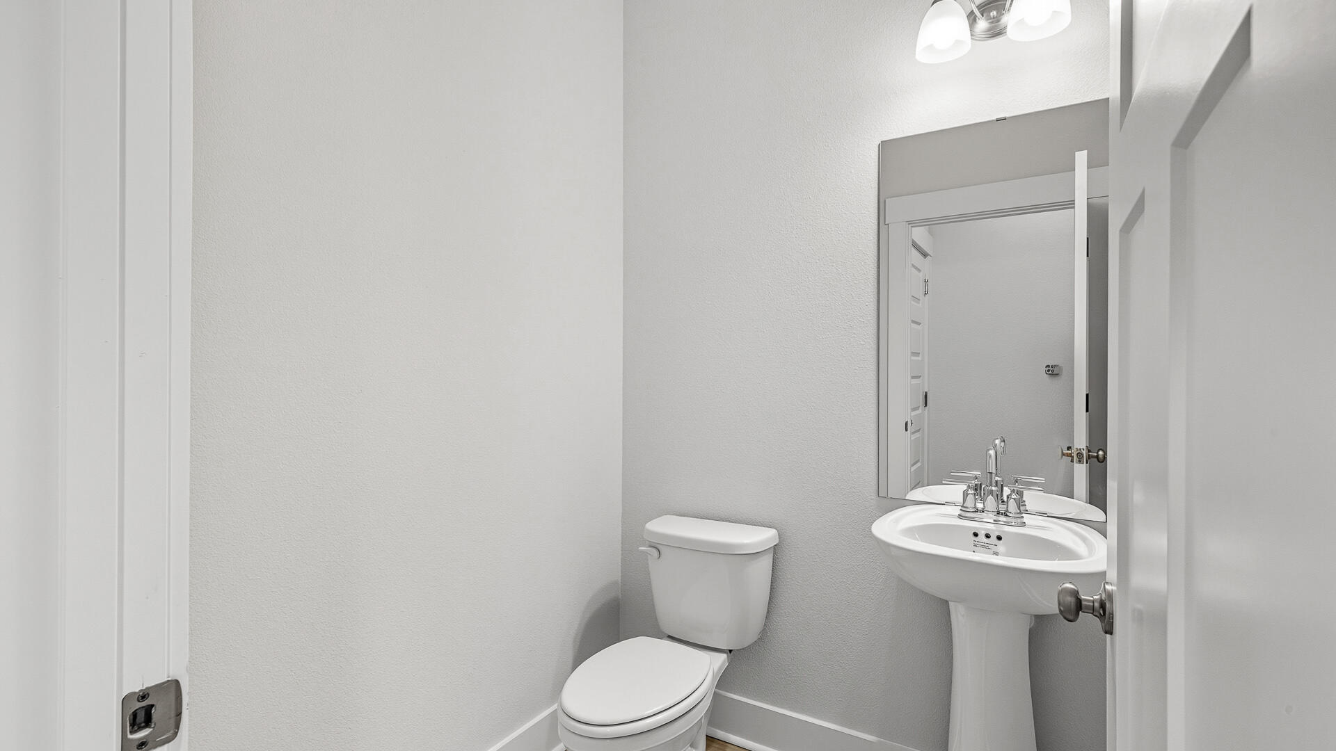 4613 Soldier Court Crestview, FL 32539 - Photo 19 of 33 a bathroom with a sink a toilet and mirror