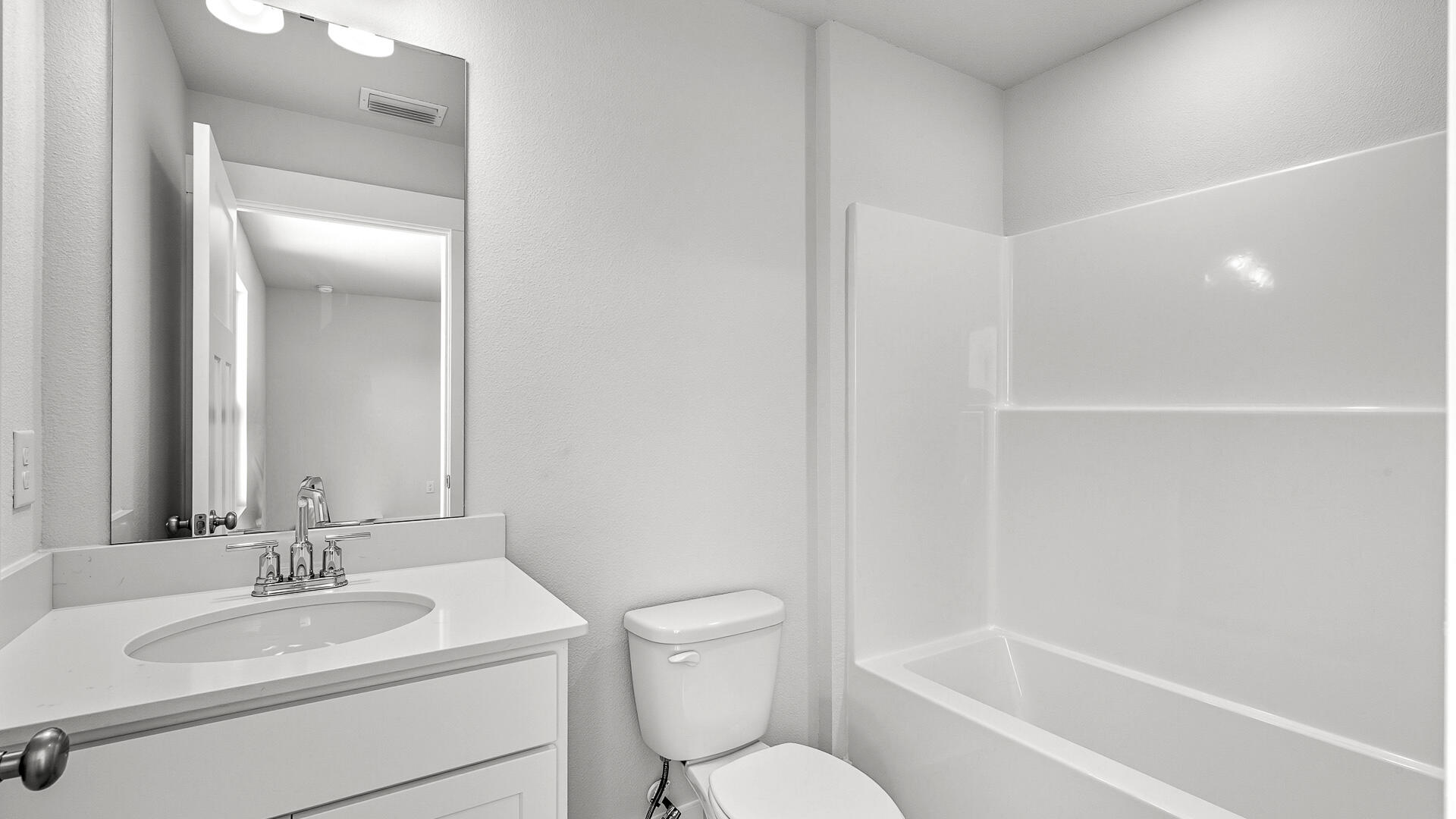 4613 Soldier Court Crestview, FL 32539 - Photo 32 of 33 a bathroom with a toilet a sink and a bathtub