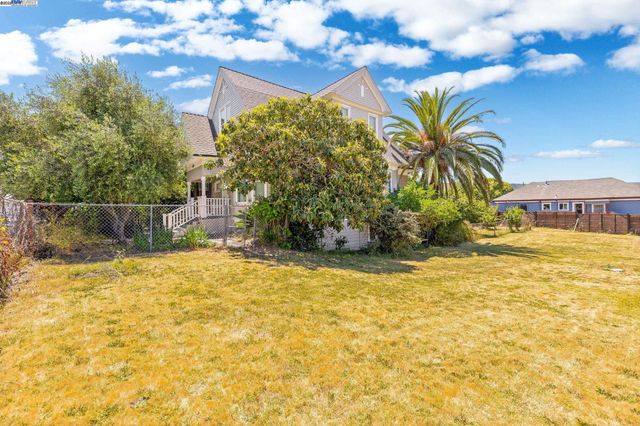 a view of swimming pool with a yard