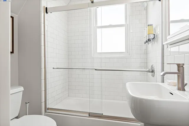 a white bath tub sitting next to a white toilet