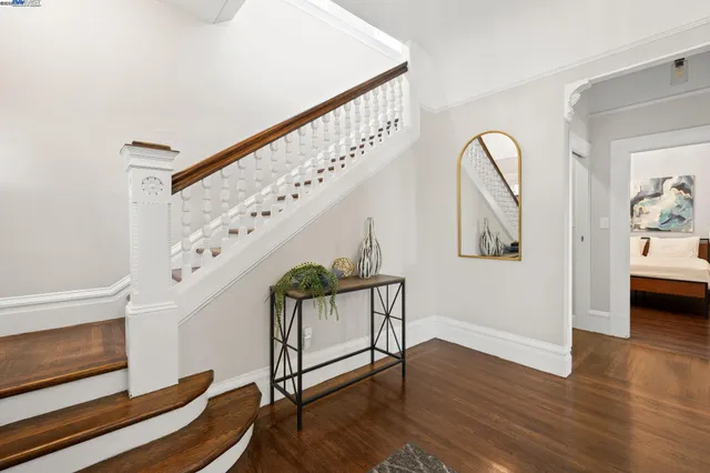 a view of entryway with wooden floor and stairs