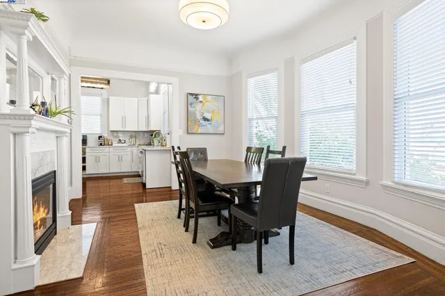 a view of a dining room with furniture window and wooden floor