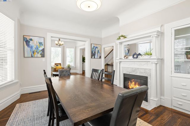a dining room with furniture and wooden floor