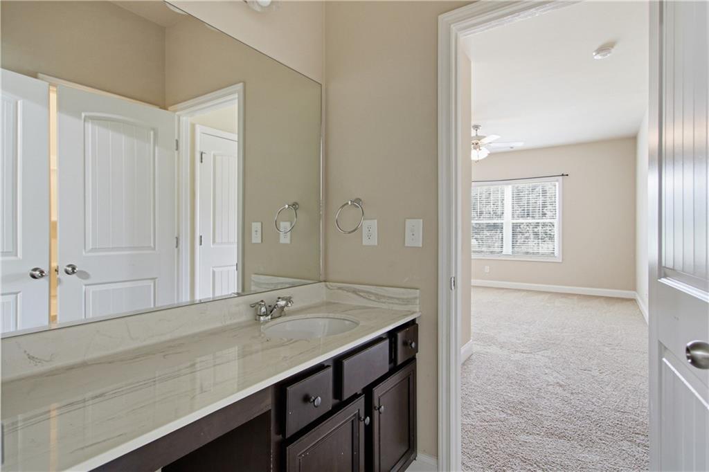 114 Madison Street Canton, GA 30115 - Photo 31 of 39 a bathroom with a sink and a mirror