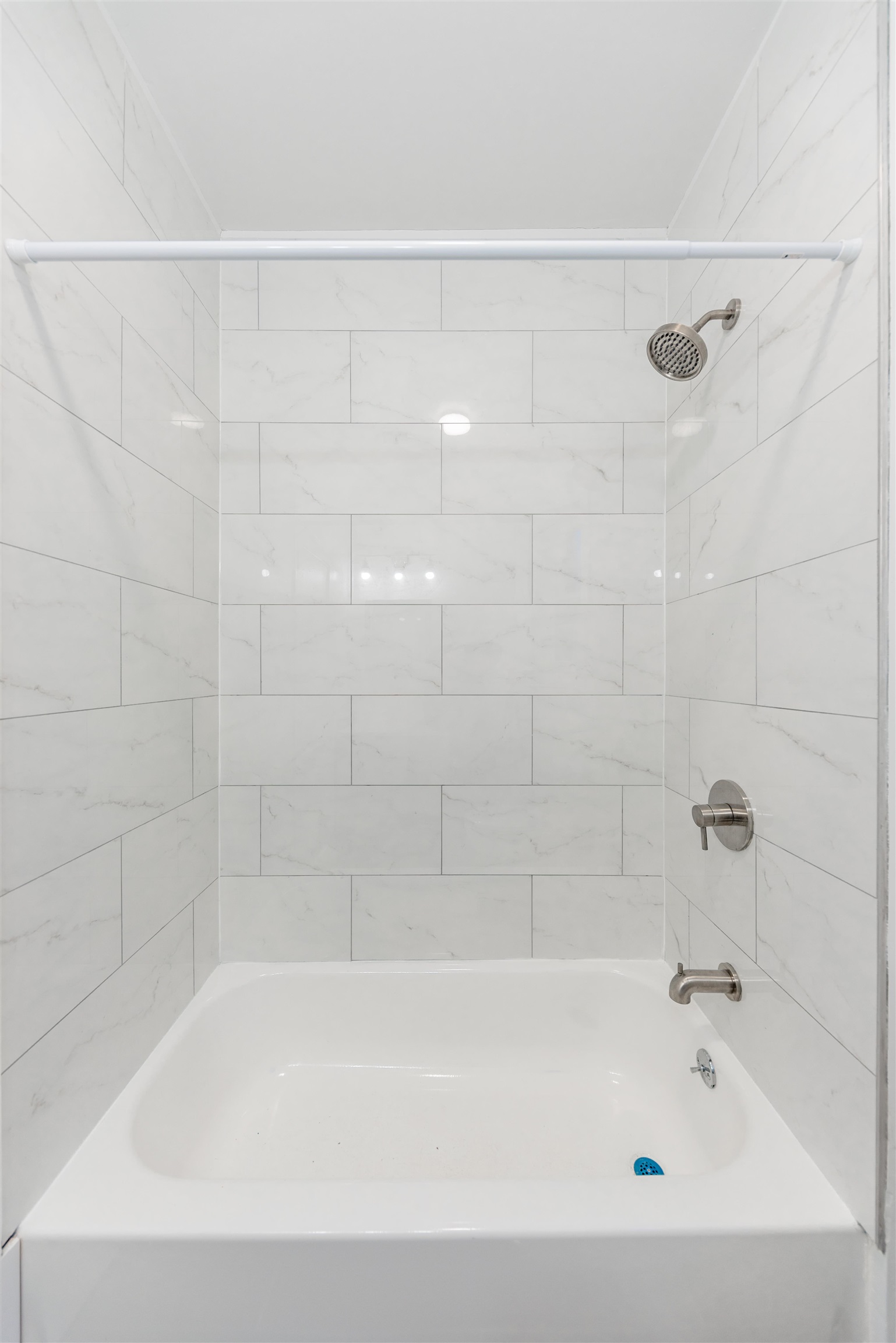 67 70th Street, Unit 2 Guttenberg, NJ 07093 - Photo 9 of 10 a bathroom with a shower and a bath tub