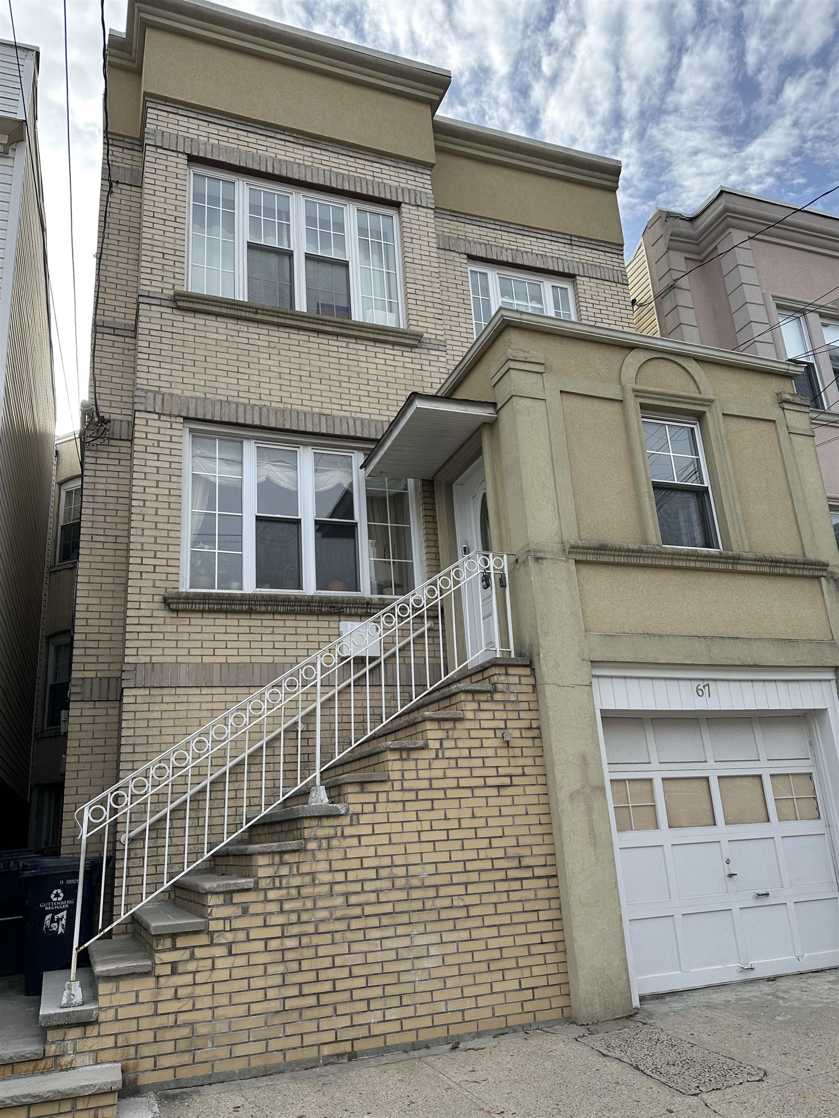 67 70th Street, Unit 2 Guttenberg, NJ 07093 - Photo 10 of 10 a brick house with large windows