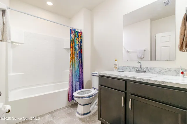 a bathroom with a sink a toilet and a bathtub