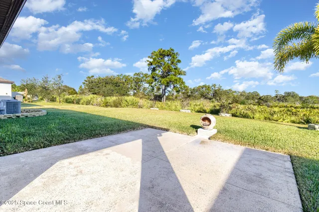 a view of a yard and ocean view