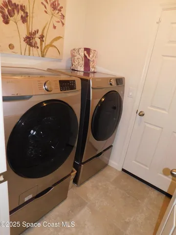 a utility room with dryer and washer