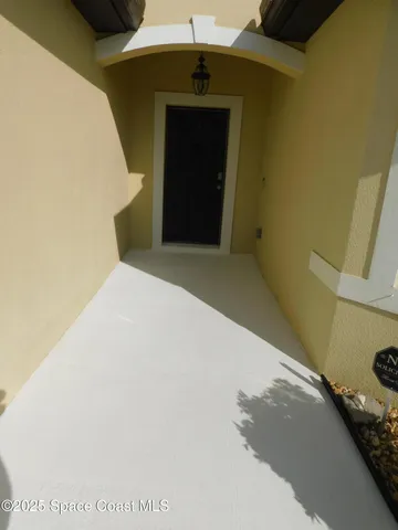 a front view of a house with seating space