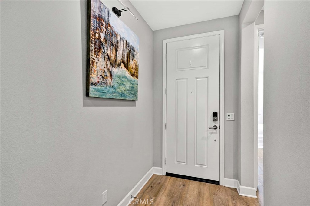 1270 Providence Loop Placentia, CA 92870 - Photo 18 of 59 a view of a hallway with wooden floor and closet