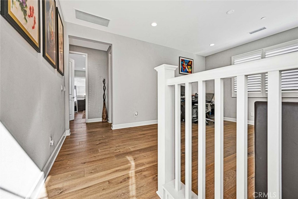 1270 Providence Loop Placentia, CA 92870 - Photo 24 of 59 a view of a hallway with wooden floor and staircase