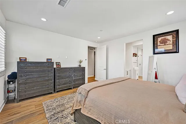 a spacious bathroom with a granite countertop sink and a mirror