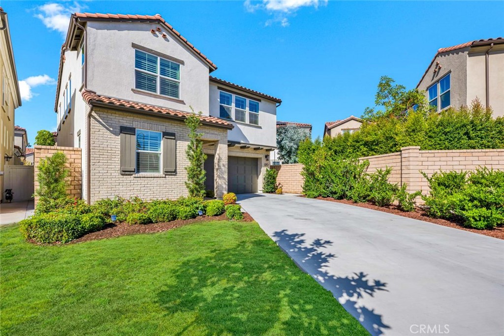 1270 Providence Loop Placentia, CA 92870 - Photo 3 of 59 a front view of a house with a yard and trees